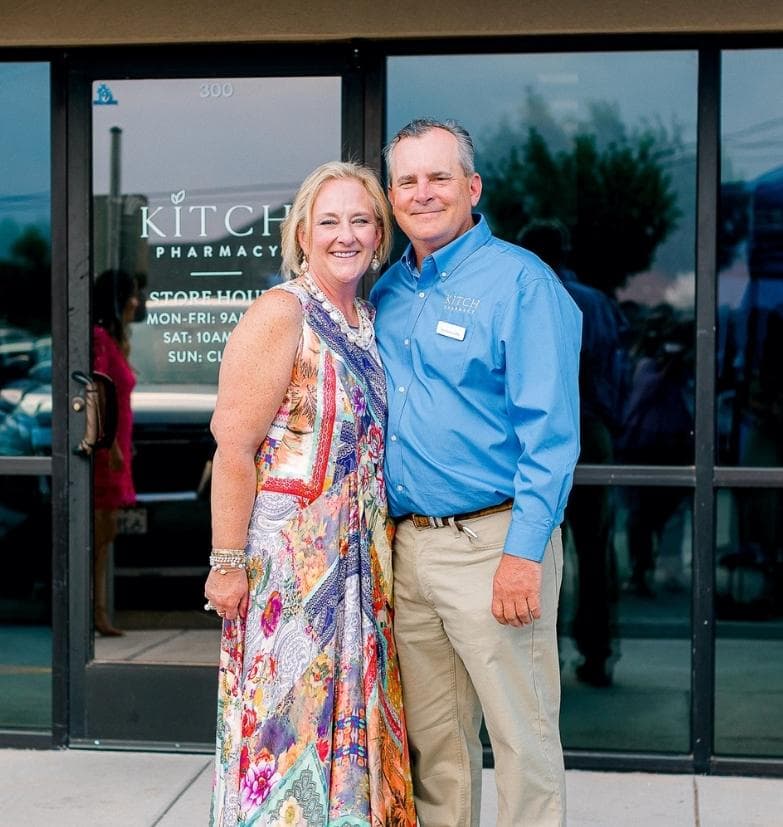 Owners Dr. Kristine Isaacson and Dieter Isaacson in front of Kitch Pharmacy